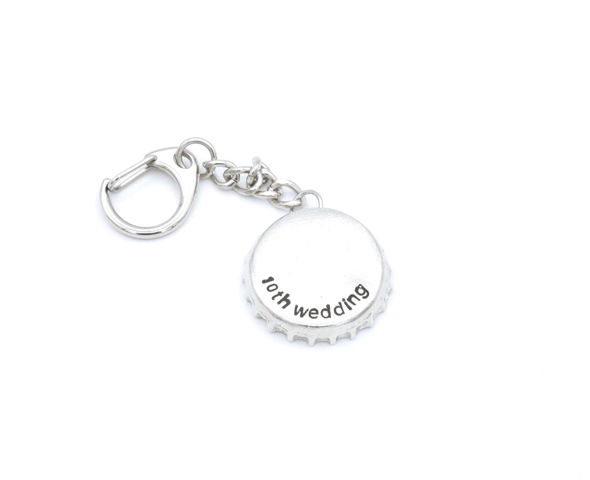 Tin 10 Year Anniversary bottle cap keyring.