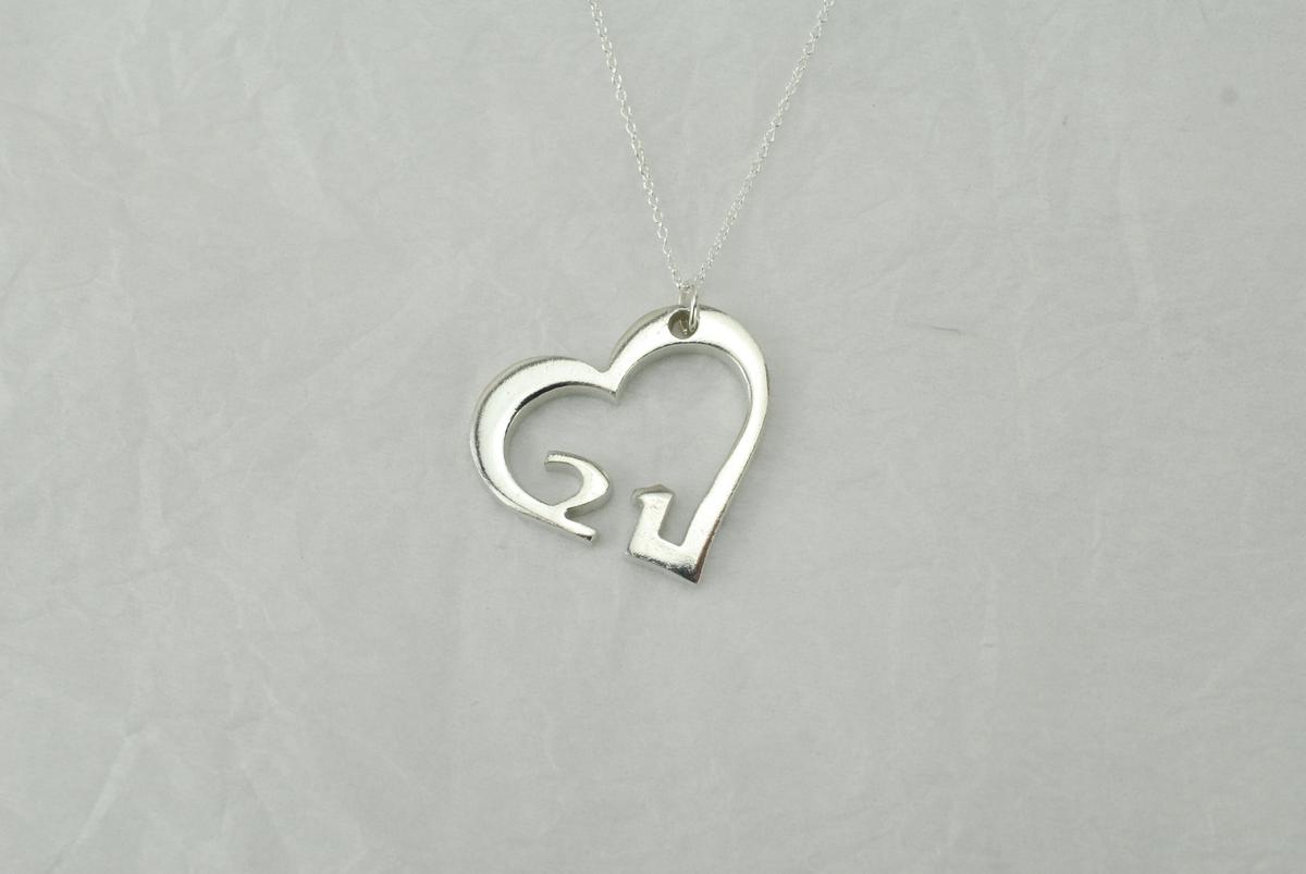 21st anniversary tin heart pendant — reverse view on sterling silver chain