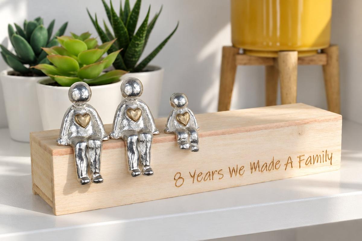 Bronze family sculpture — handmade 8th wedding anniversary gift with personalised bronze family figurines, made in Cornwall
